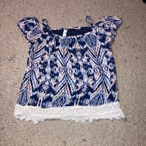 A blue, white, and peach color off shoulder top.